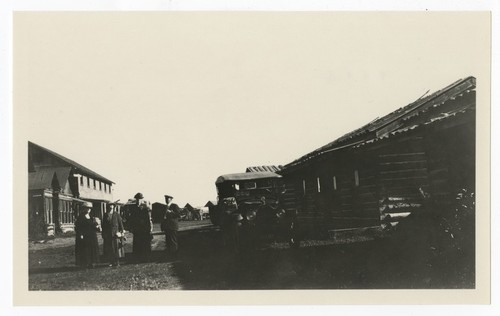 Group posing near lodgings, Yellowstone National Park