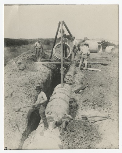 Laborers installing concrete pipeline for Sweetwater siphon