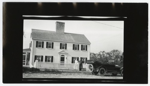 Mary Fletcher with people in front of house