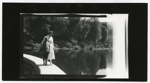 Woman and child on Eagle's Nest Dam edge, San Diego County