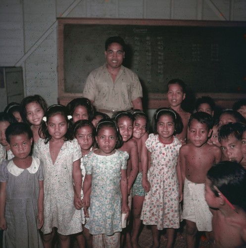 Teacher and children in a classroom