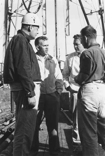 Roger Revelle, Willard Bascom, Gustaf Arrhenius and Walter Munk on CUSS I during preliminary drilling for Project Mohole, December 1961