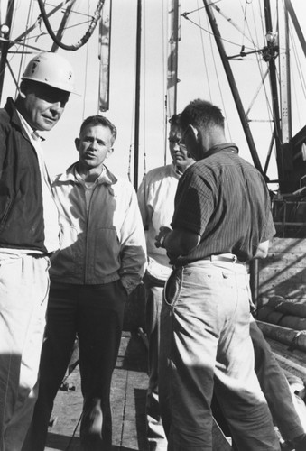 Roger Revelle, Willard Bascom, Gustaf Arrhenius and Walter Munk on CUSS I during preliminary drilling for Project Mohole, December 1961