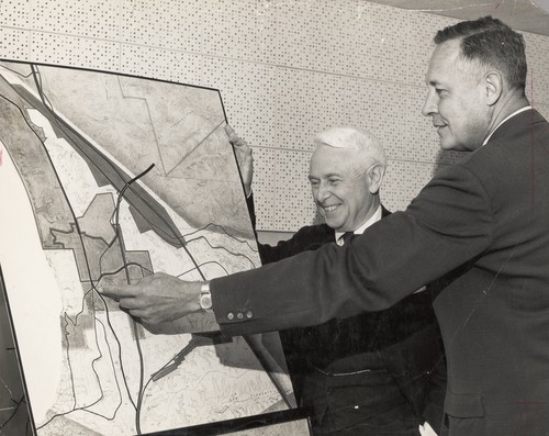 University of California Regent Donald H. McLaughlin and Roger Revelle examine map of proposed site of University of California campus at San Diego. 1959