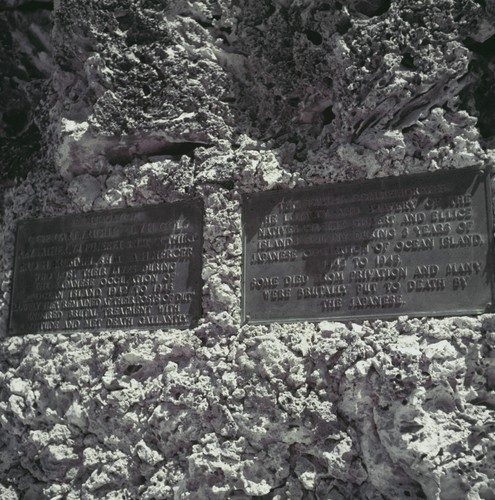 Close up of the bronze plaques on the World War II monument to natives of the Gilbert and Ellice Islands