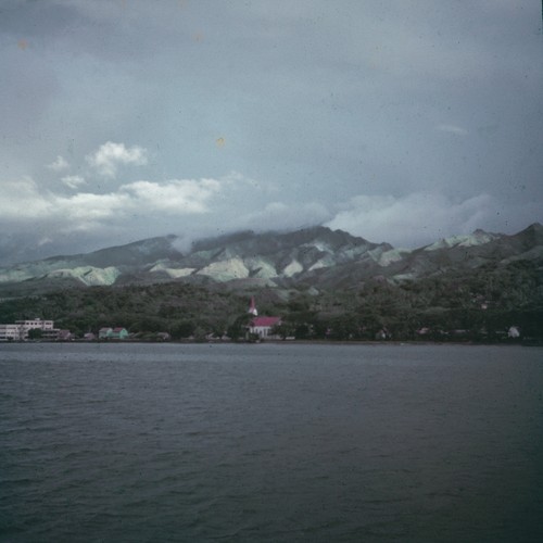 Island village as seen from a ship at sea