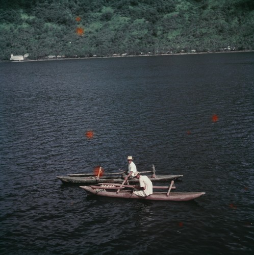 Men in outrigger canoes