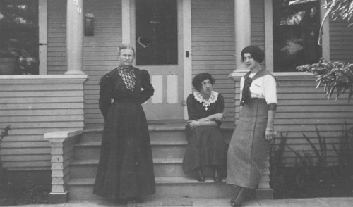 Group portrait of three women on steps of house, Orange, California, ca. 1915