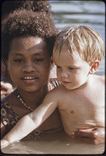 Young woman named Linette taking care of an Australian child, Butch Holland