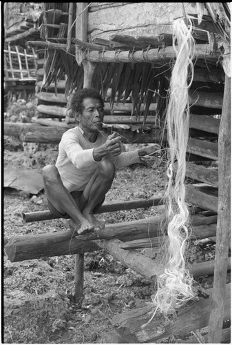 Mogiovyeka, smoking cigarette and making a fishing net