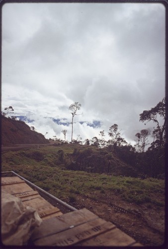 Highlands Highway between Lae and Mount Hagen: road cut into hillside, seen from back of a truck