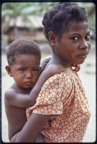 Kairiru: adolescent girl carrying a younger child on her back