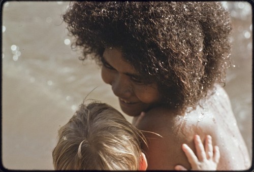 Young woman taking care of an Australian boy, Butch Holland