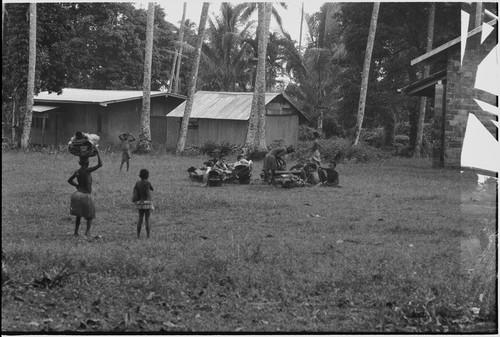 Mortuary ceremony: women gather with exchange items, including baskets of banana leaf bundles