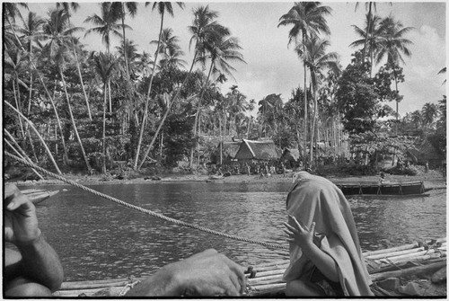 Tukwaukwa village on Kiriwina: seen from canoe in lagoon