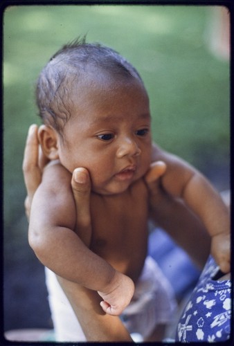 Young infant wearing a cloth diaper