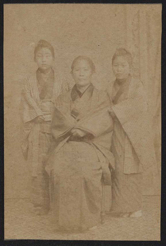 Woman and two girls wearing kimonos