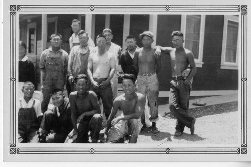 Group of Workers in front of a House