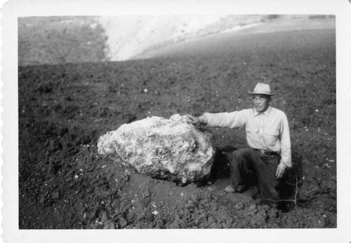 Man with Large Rock