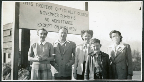 Photograph of Bea White and son, with Lucille Bouche and Elizabeth Moxley at the closing of Manzanar