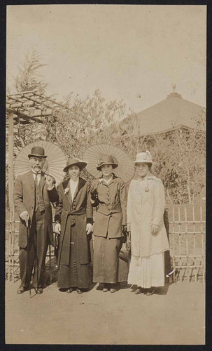 Man and women posing outside