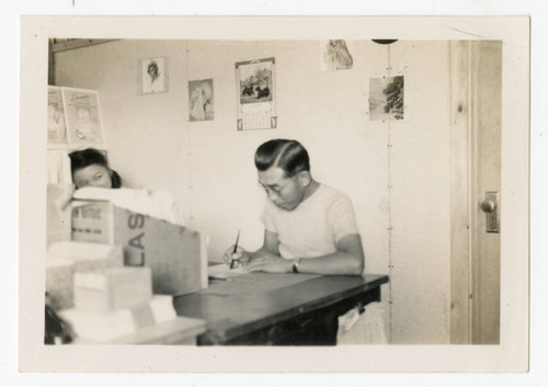 Man and woman at desk at Heart Mountain