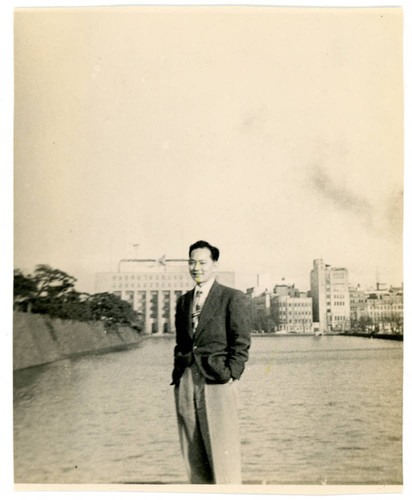 John Yoshinaga in front of Dauiichi Building