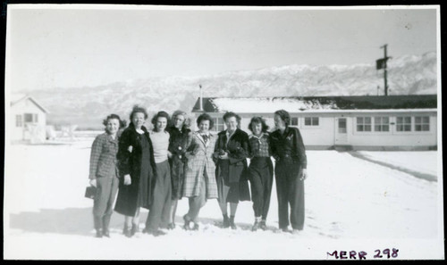 Photograph of a group of women in front of staff housing