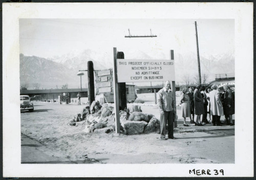 Manzanar is now officially closed. Mr. Merritt addressing the staff that gathered at the gates of Manzanar to witness the departure of the last evacuee from the Center. November 21, 1945