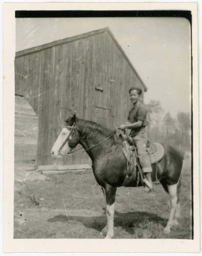 John Yoshinaga riding horse