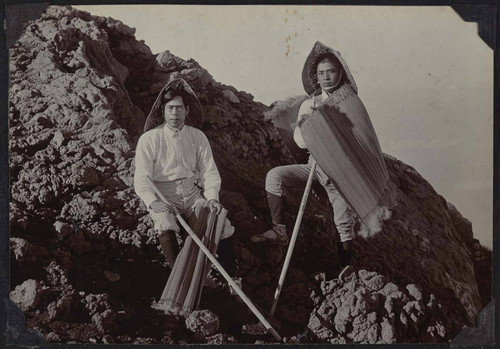 Photograph of men posing by the beach