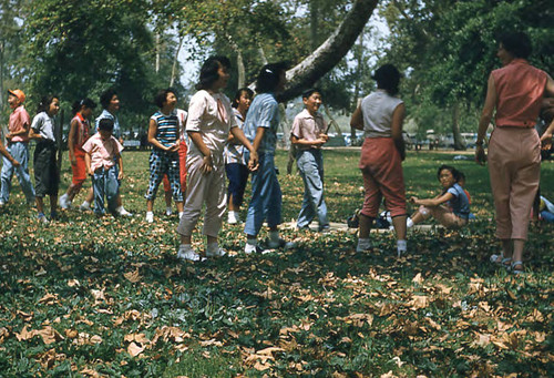 Woman, young girls, and children at Little Miss picnic