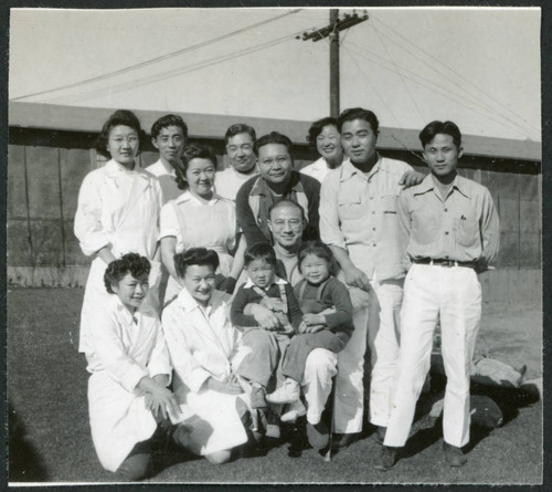 Photograph of hospital staff with children at Manzanar