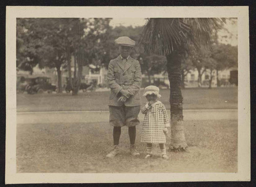 Boy and young girl outside