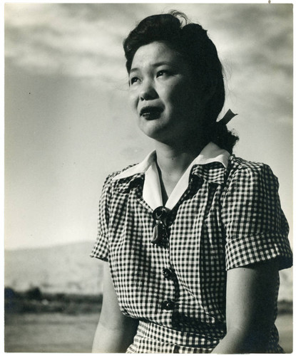 Photograph of a young lady wearing a dress