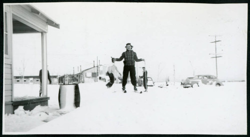 Photograph of a woman on skies at Manzanar