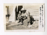 Kenneth Kenji Kuwahara and George Naohara crushing coals at a hospital