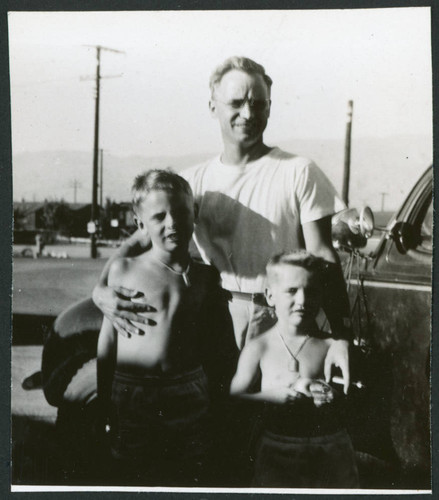 Photograph of Dr. Morse Little and his two sons getting ready to depart