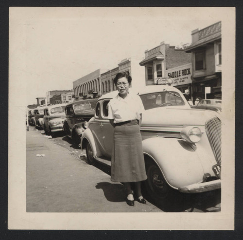 Woman standing on a sidewalk in Sacramento's Japantown