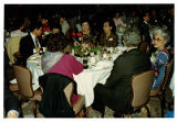 Group photo at table for woman warrior awards dinner