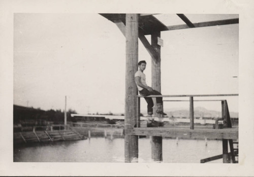 Young man at the swimming facilities at Poston incarceration camp