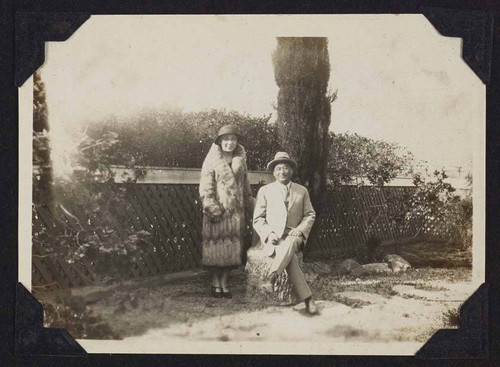 Man and woman posing in yard