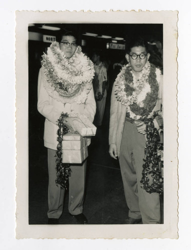 Hideyuki Takamori standing next to a young man