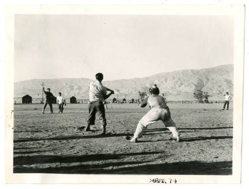 Photograph of boys playing baseball at Manzanar