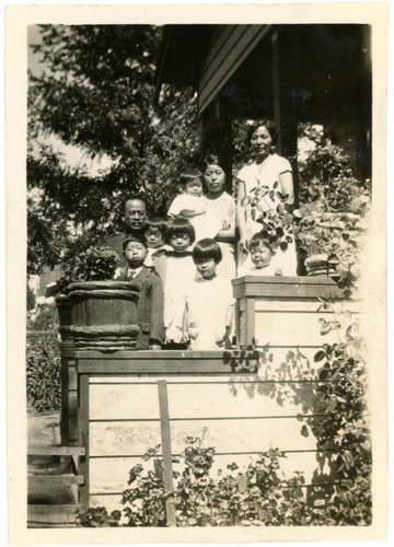 Yoshinaga family standing on stairs