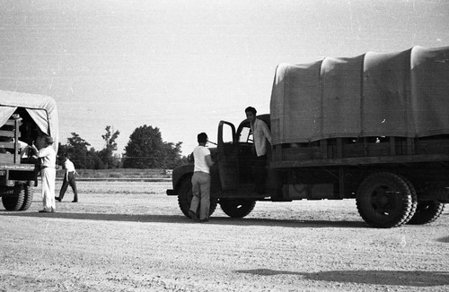 Man exiting truck in Jerome camp