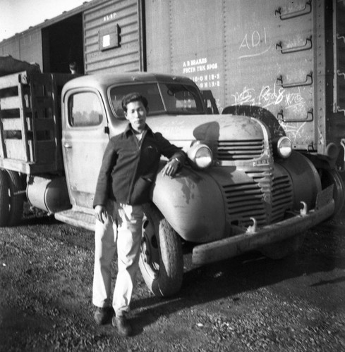 Nisei man with truck in Jerome camp