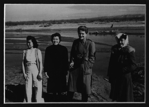 [Group photo by the river]