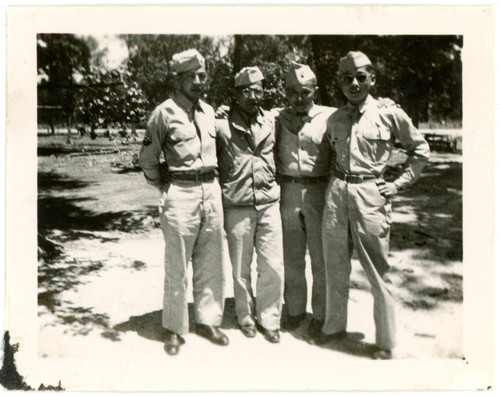 Men in military uniform at incarceration camp