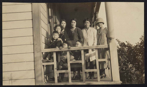 Women and children on a porch